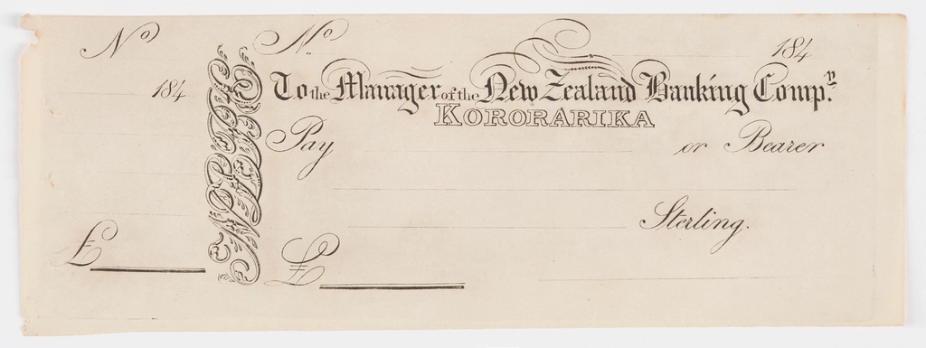 An old-style chequebook lying on a desk, representing documents relating to cheque law