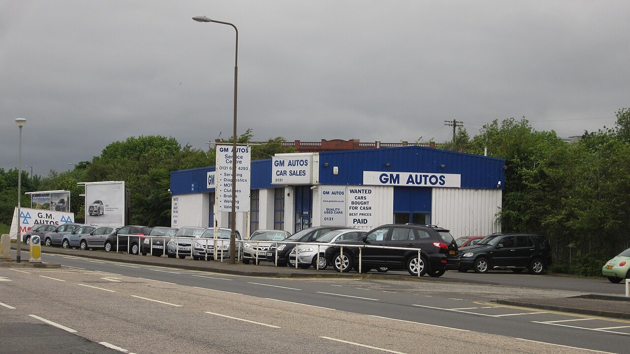 Vehicles displayed for sale at a used car dealership