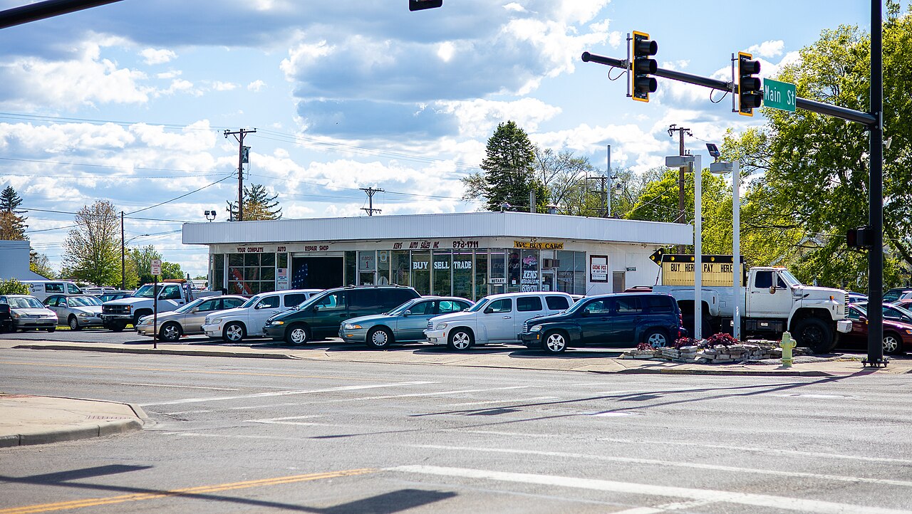 Vehicles on display in the sales area of a used car dealership