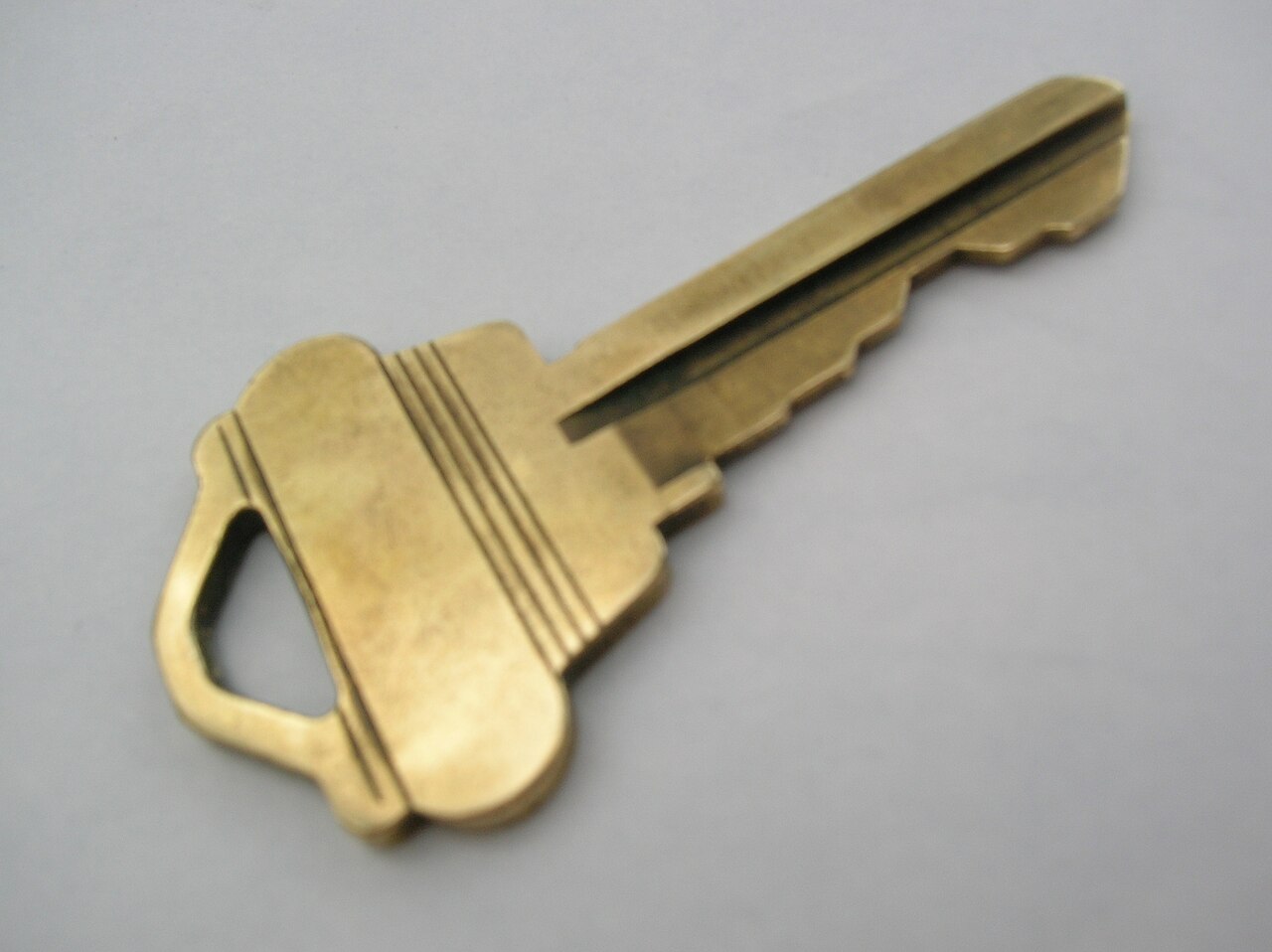 An image of a house key symbolising the landlord and tenant handing over the keys