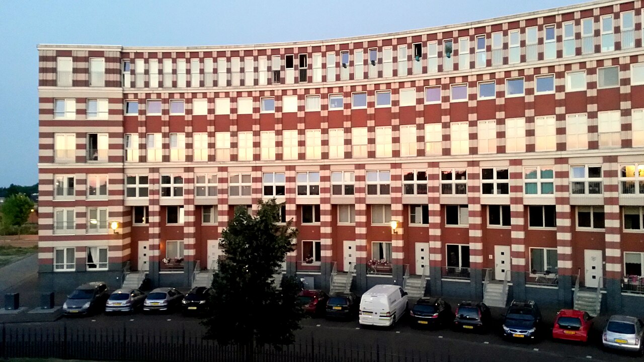Apartment buildings lined up side by side in the city, representing the dwellings in which lease relationships arise