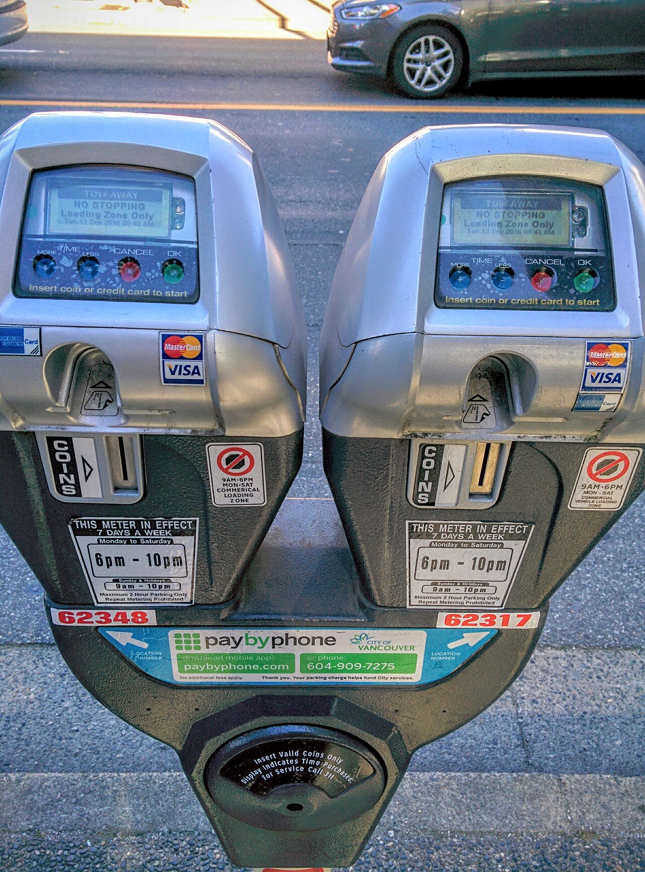 A person making a credit card debt payment and calculating interest