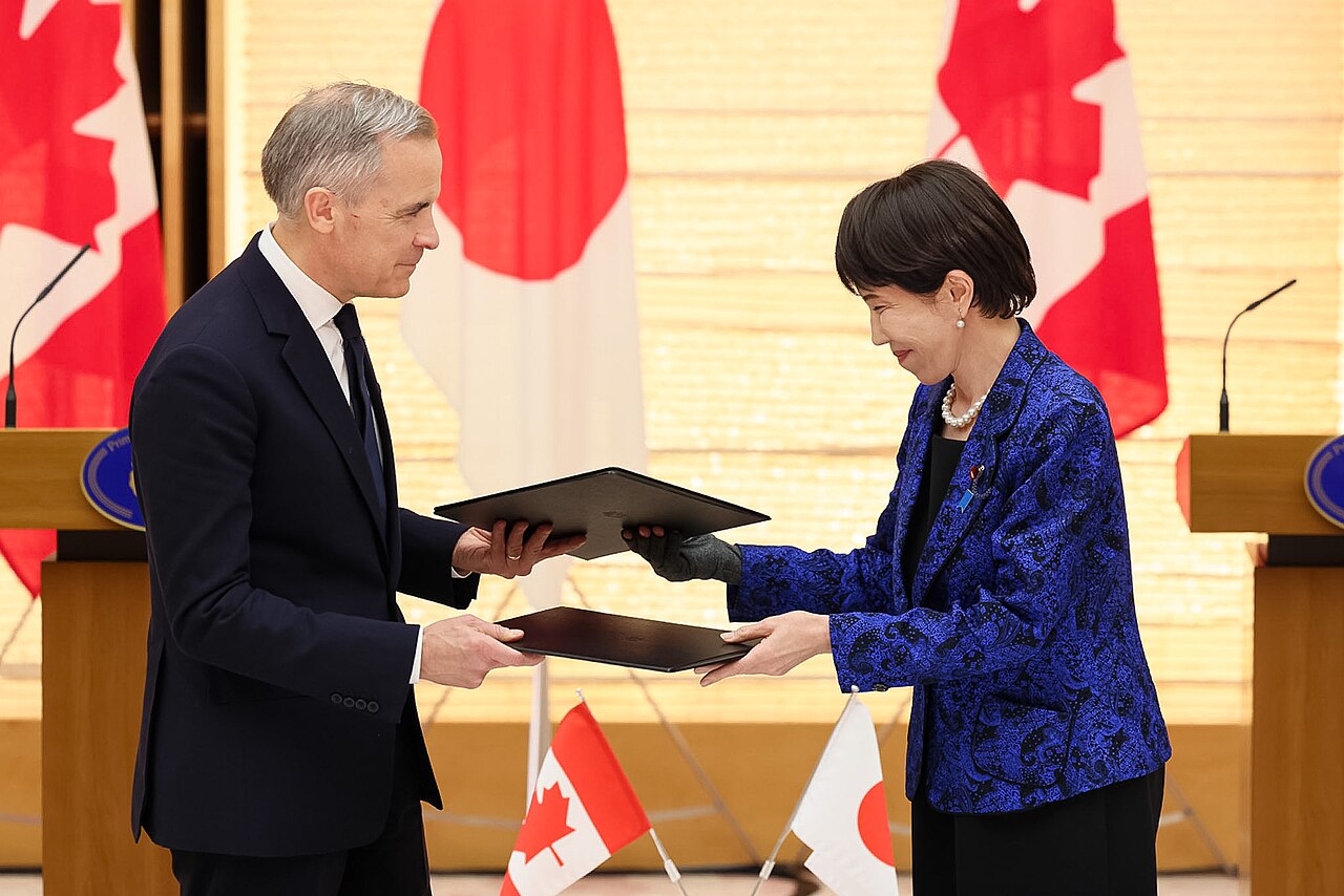 Hand and pen during the signing of an official document